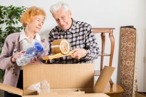 Relocation: Senior adults packing and moving to a new house